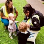 Home-Start Cambridgeshire volunteers with toddler in park